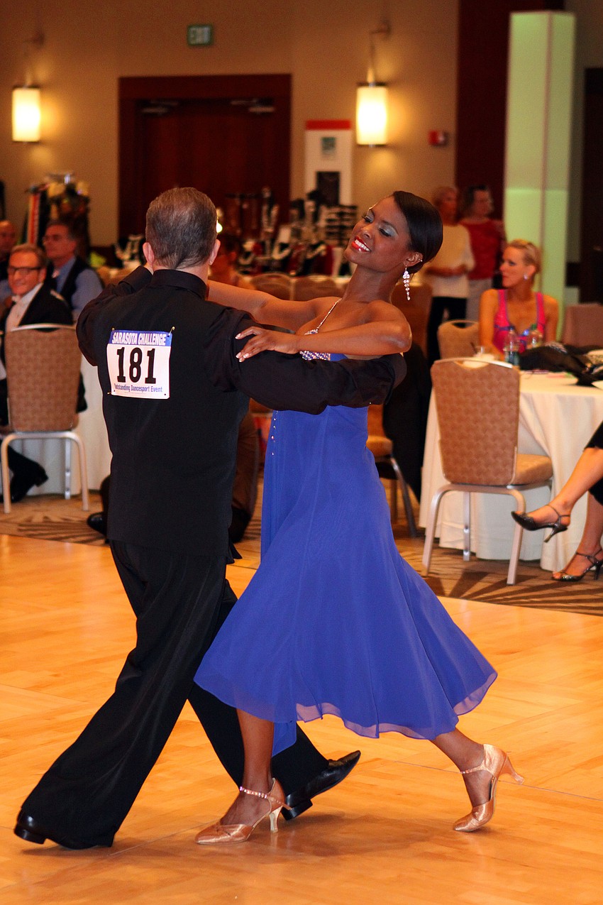 Gilbert Osorio leads Ashley Jones around the ballroom dance floor, Sunday, Jan. 15, during the Sarasota Challenge at the Hyatt Regency.
