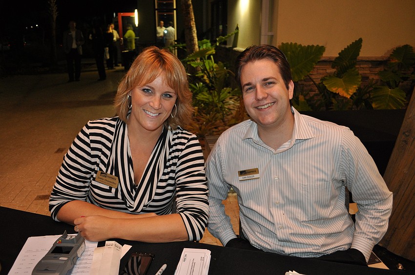 Jamie Overmiller and Dan Slider, of the Sarasota Chamber, checked in guests.