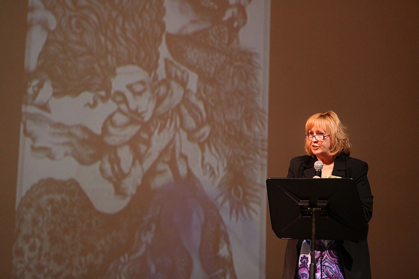 Julie Felts, art teacher at Booker High VPA, talks about the art program, Thursday, Jan. 19, during the Booker High Magnet Night for Visual Performing Arts.