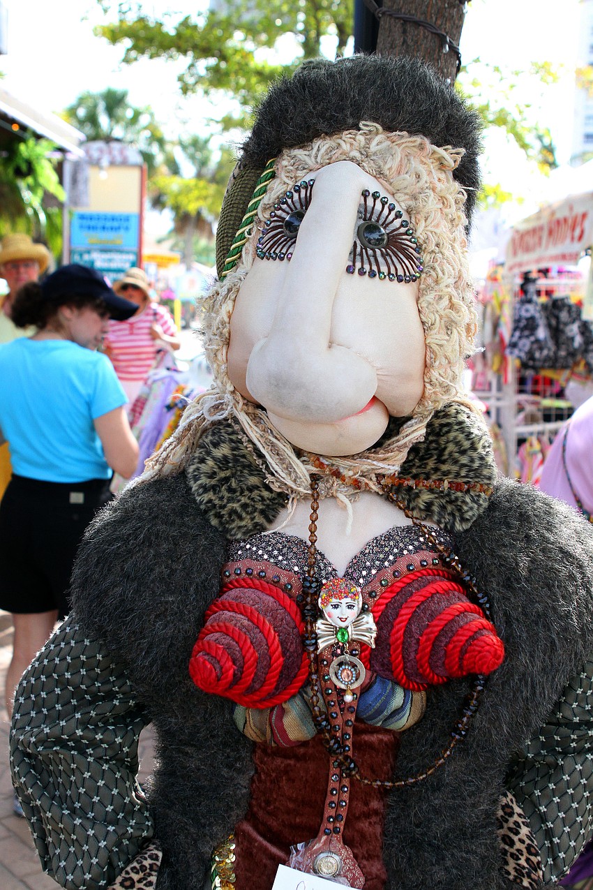 A very fashionable doll woman modeled jewelry made by Painted Lady.