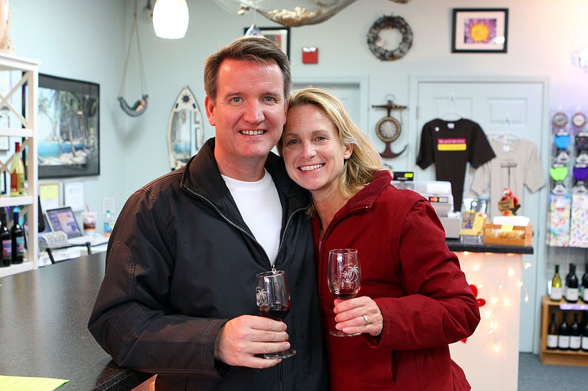 Ed and Lucinda Smith have fun doing some wine tasting at Siesta Key Tropical Wines during the Valentine's Stroll.