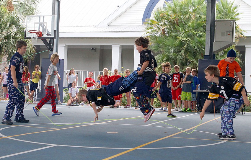 David Smith and Carson Baer do some crazy jumping tricks while Conor Gallagher and Ethan Marino keep the rope moving, Friday, Feb. 10 at Out-of-Door Academy.