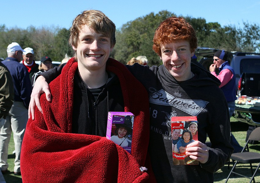 Dale Feick and Jim Lockhart bought some Girl Scout cookies at the polo match, Sunday, Feb. 12.