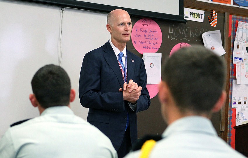 Gov. Rick Scott talks to students during their Government class, Friday, Feb. 17.