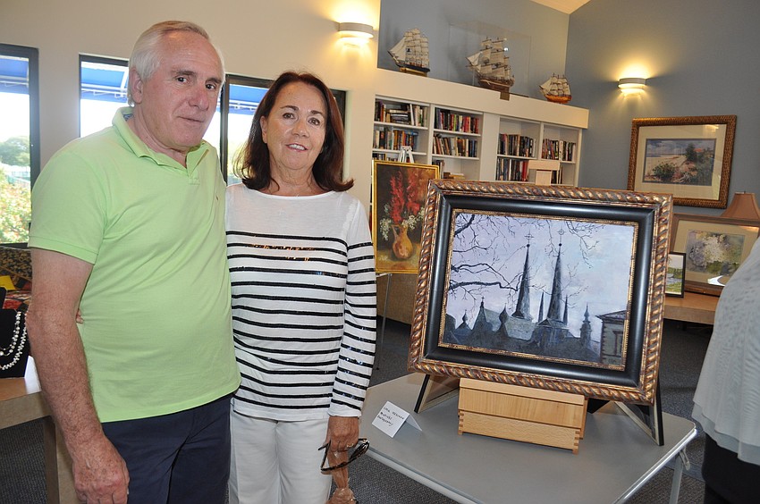 Peter and Clara Martini in front of Carol Meashamâ€™s painting