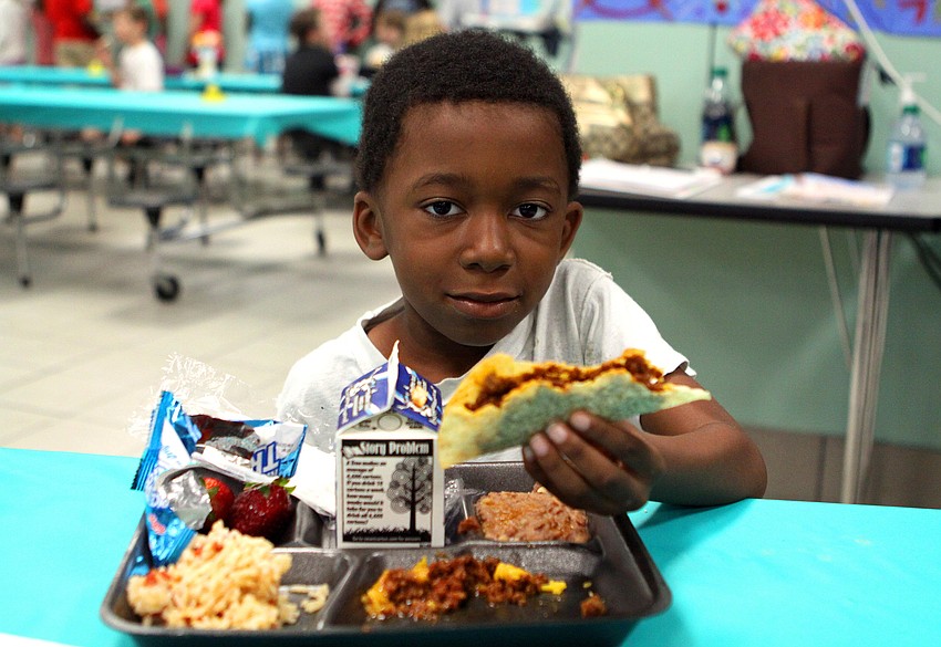 Adarius Langston, 7, enjoys his taco at El Restaurante Bay Haven, Thursday, Feb. 23, at Bay Haven Elementary.