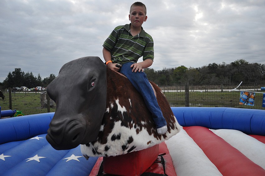 Colby Gray, 10, tested his bull-riding skills.