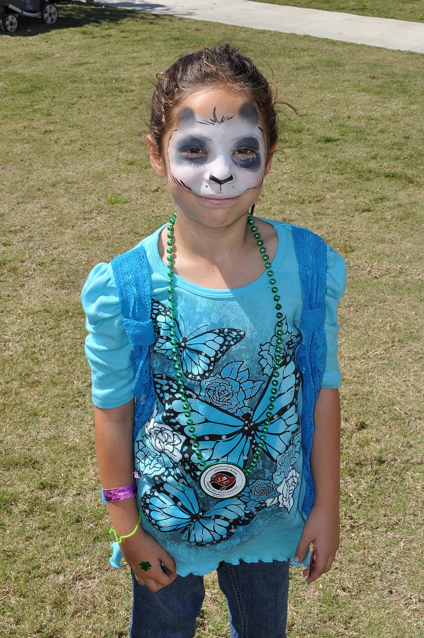 Seven-year-old Skye Redman got her face painted like a panda bear.