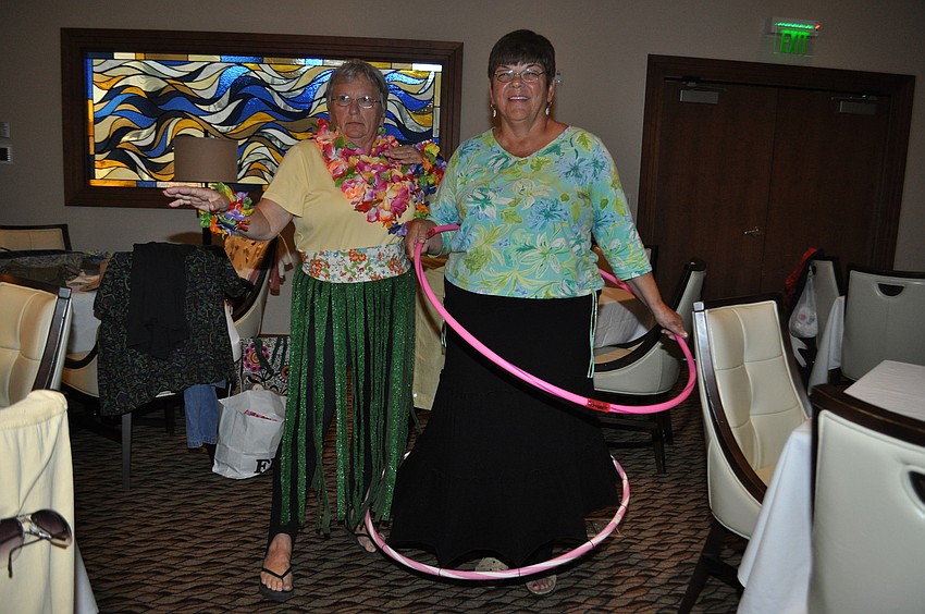 Rose Kelley in a grass skirt and Ginny Wilcox in a hoop-skirt