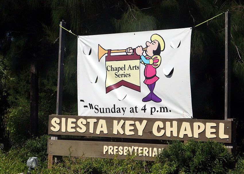 A banner was hung out by the road to let people know that there was a performance happening at Siesta Key Chapel.