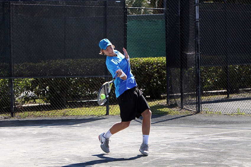 Joel Link goes to hit a forehand during his match against EJ Sanford.