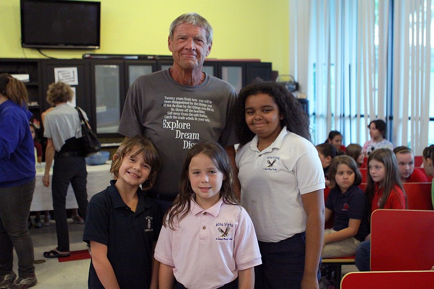 â€œMr. Billâ€ Johnson poses with Chloe Bernardin, 9, Harlee Hopson, 8, and Mercedes Chamber, 11.