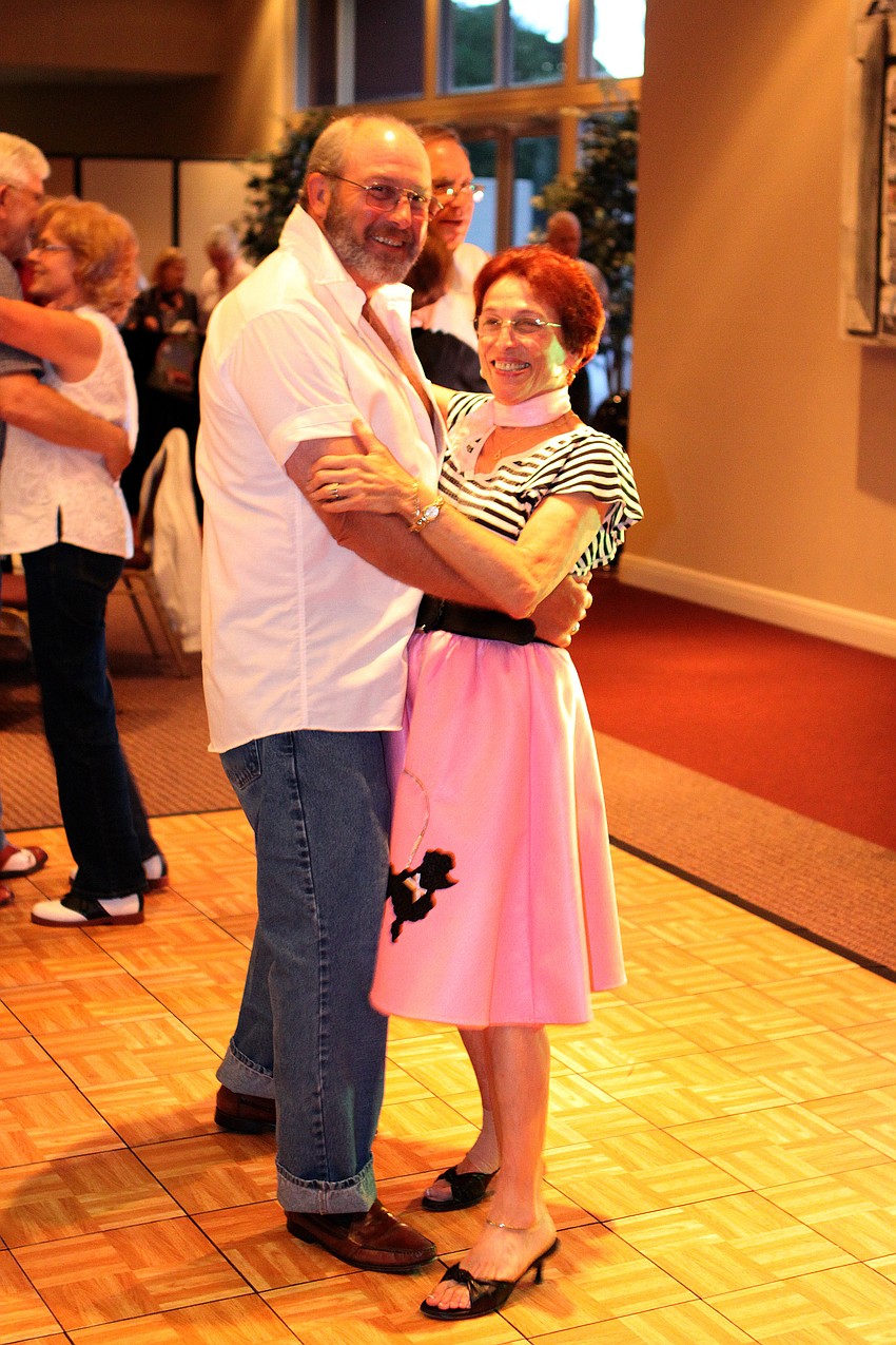 Micki and Gene Evans smile away while out on the dance floor.