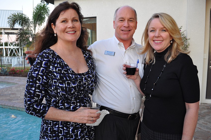 Julia Applegate, left, and Debbie Rempert, right, both of Atchley International Realty, caught up with Kirby Wood, center, of Prudential Lakewood Ranch Realty.