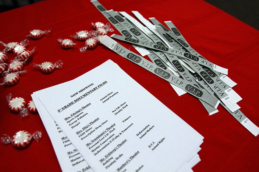 Candies, programs and VIP bracelets were spread out on a red table cloth, Thursday, Jan. 12, for the 5th grade Documentary Film Fest at Phillippi Shore Elementary.