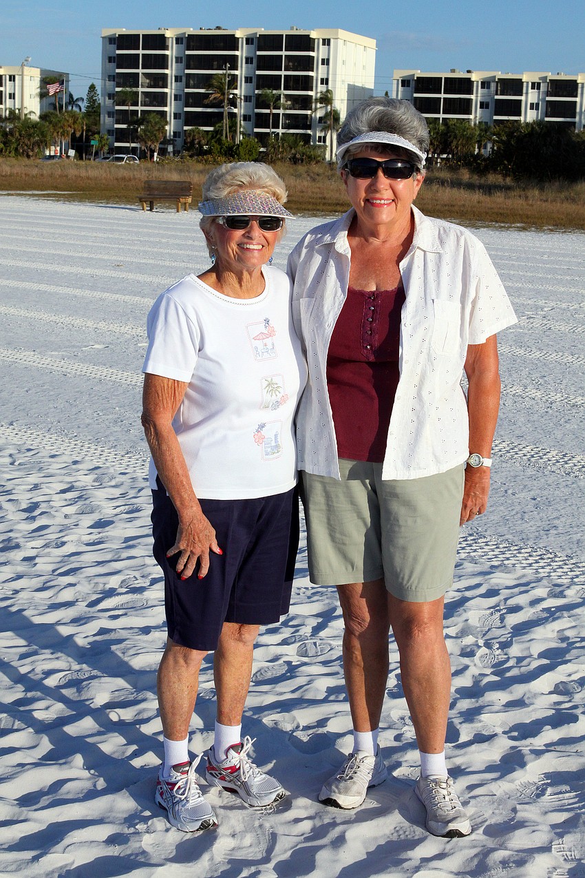 Mary Jane Smith and Pat Leroux wear their shiny visors to walk the beach, Wednesday, Feb. 1, during the Senior Beach Walk on Siesta Key Beach.
