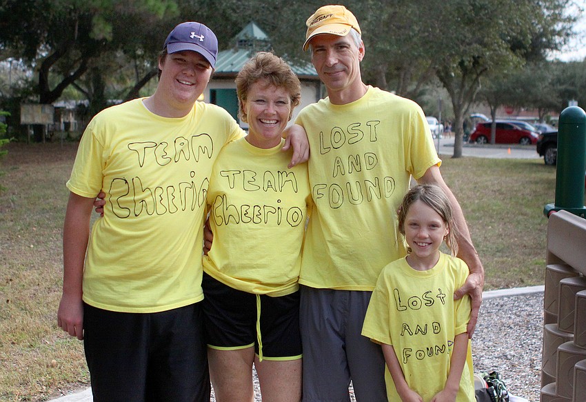 Tyler Ford poses with Dann, Eric and Lauren, 10, Sayban