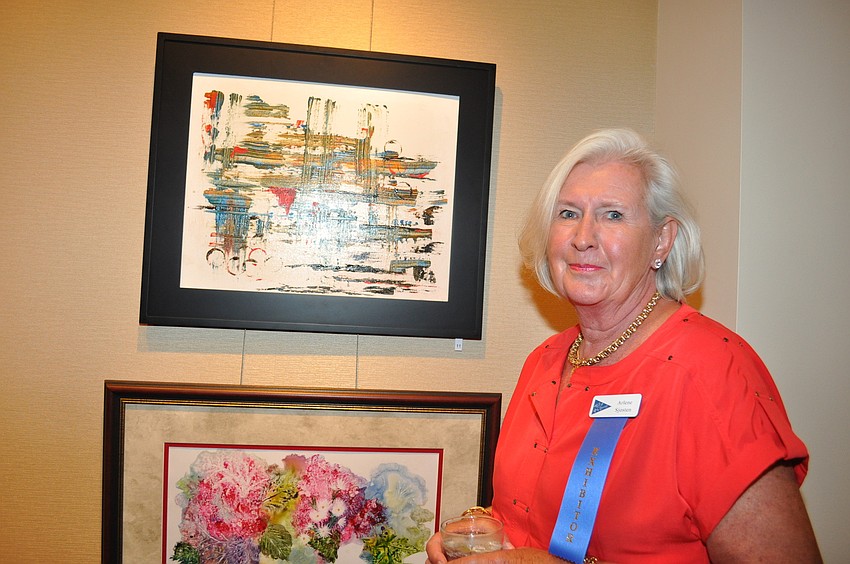 Arlene Sjosten in front of her work â€œPhoto Finishâ€