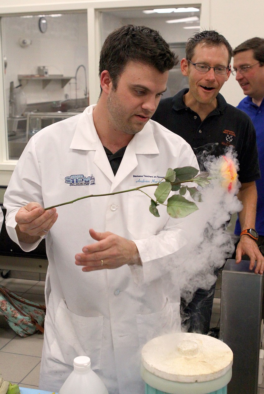 Andrew Harshman freezes a rose with liquid nitrogen.