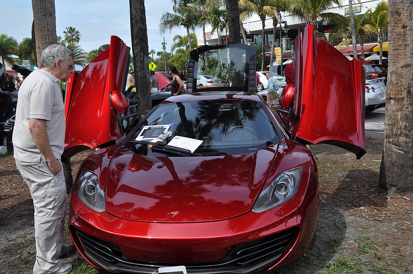 Norman Gassman looking at a McLaren 2012 MP4 12C