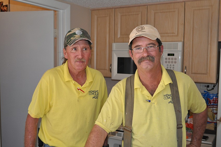 Pat Sissem and Joe Ganey prepared the hot dogs for the event.