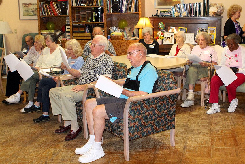 Friends of Elizabeth Delaney sang traditional Irish songs during Elizabeth Delaney's 109th birthday party, Monday, March 12, at the Senior Friendship Center.