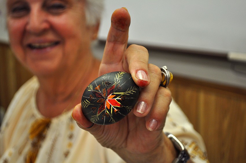 Tetiana Silecky shows of the final product of her demonstration, Tuesday, March 13, at the Gulf Gate Library.