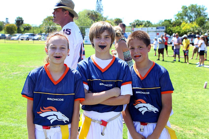 Erin Luhrsen, 10, Michael Donato, 13, and Noah Ribort, 11, all play together on the Broncos.