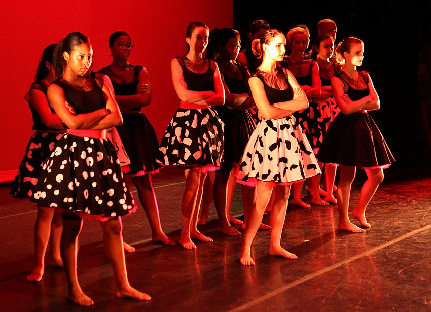 Students fold their arms and watch the â€œfightâ€ during the dance â€œConflict Resolutionâ€.