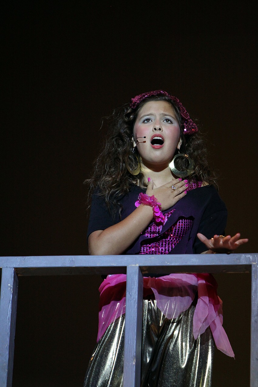 Carmen Diaz, played by Pamela Kurpiewski, 7th grade, sings her heart out during â€œThere She Goes/Fameâ€, Saturday, April 22.
