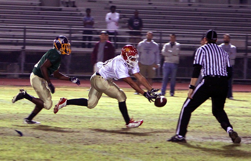 Ricky Jones, Jr., 4, runs after Hershel Caywood, 58.