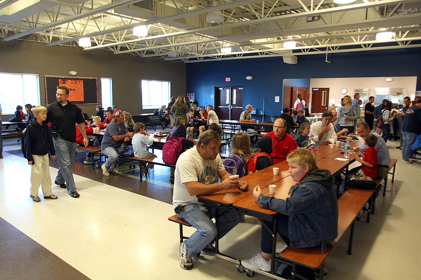 Dozens of dads got up early and had a donut breakfast with their children, Friday, Jan. 13, at Imagine School's 