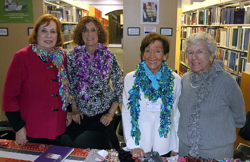 Natalie Kaufman, Shelia Weiser, Joyce Rubin and Rita Wolson wear scarves they made as members of Professionals Assisting Military Friends and Families.