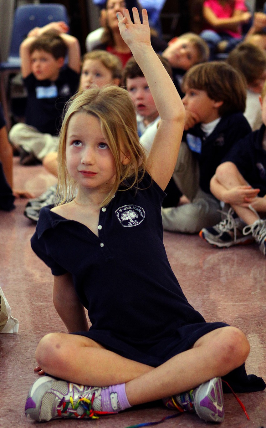 Caroline Steinwachs, 5, raises her hand to ask a question, Friday, Jan. 20, at Out-of-Door Academy.