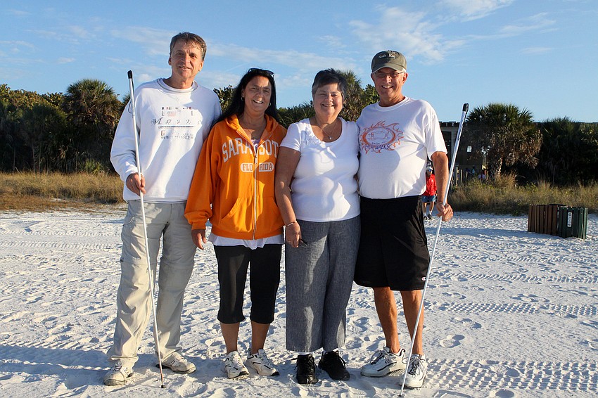 Richard and Lori Wilkinson get ready to walk the beach with their friends Sheila and Jim Niswander.