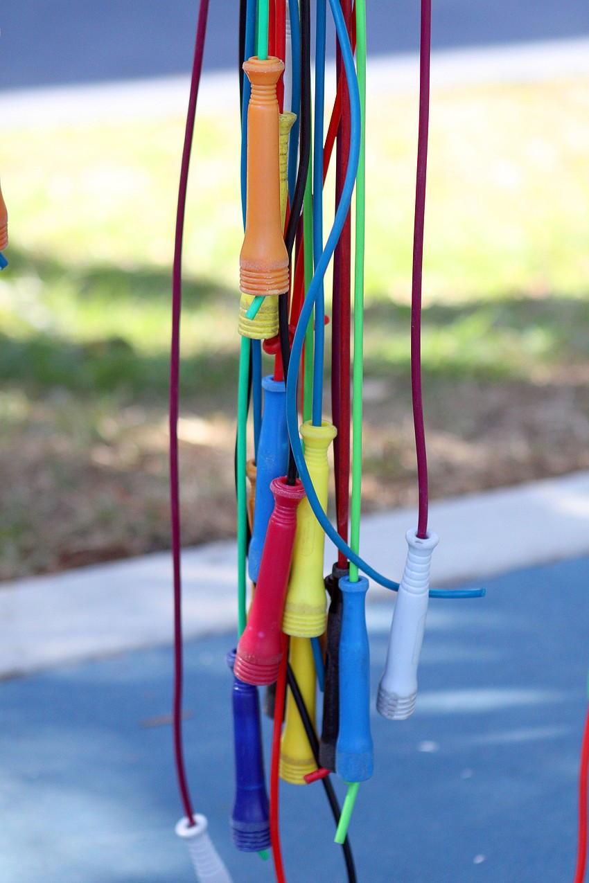 A bunch of colorful jump ropes hang down inside the Dart Pavilion.