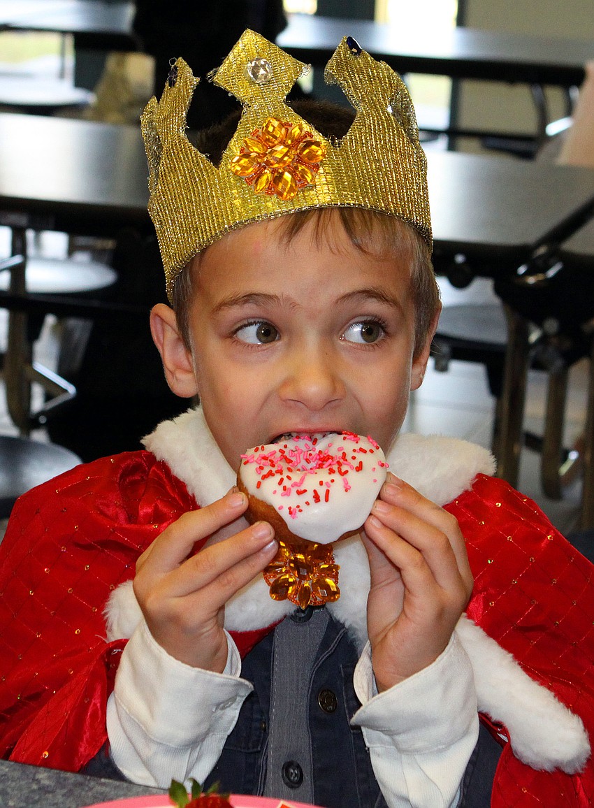 Alex Maxucci, 5, bites into his donut.