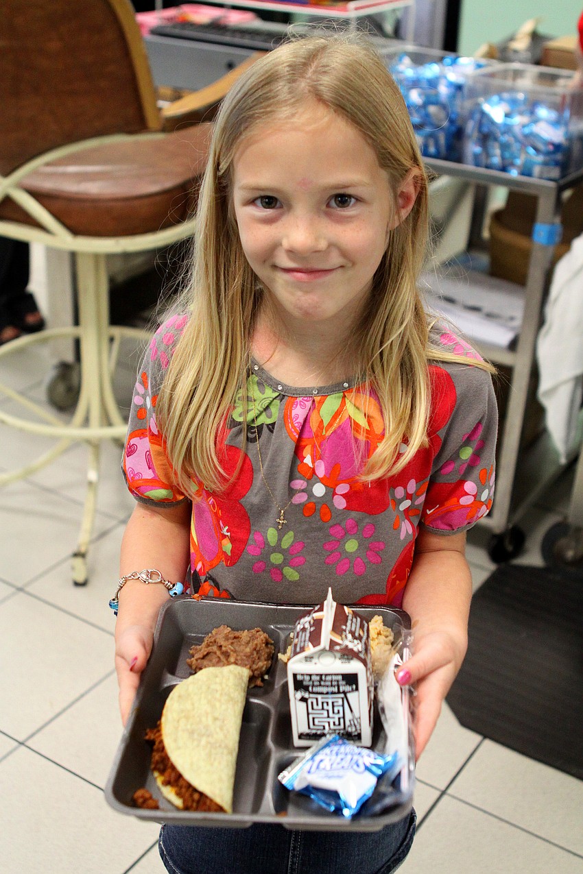 Amelia Miley, 6, with her Mexican themed lunch, Thursday, Feb. 24, at Bay Haven Elementary.