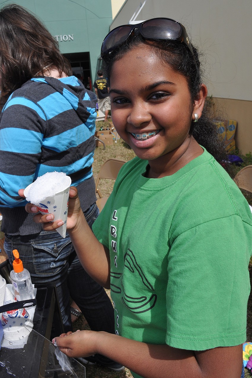 Lakewood Ranch High School Key Club member Ariana Rupan dished out shaved ice for snow cones.