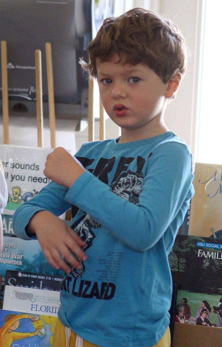 Cash Murphy, 4, does the motions to 