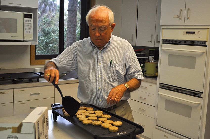 Nick Pearce cooks up some sausage for the Siesta Key Chapel Men's Fellowship breakfast.