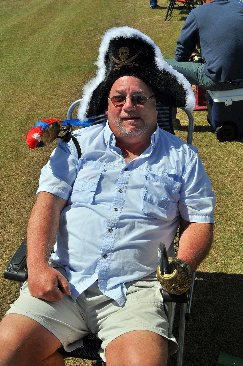 Bill Meredith with his parrot, 