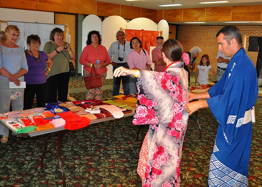 Brian and Melissa Nell of the Manatee/Sarasota Kimono Club gave a demonstration on how to put on different kimonos.