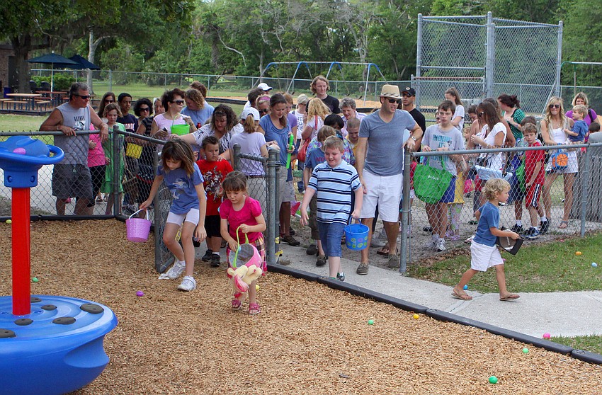 The kids and parents head into the playground area where there were over 650 eggs to find.