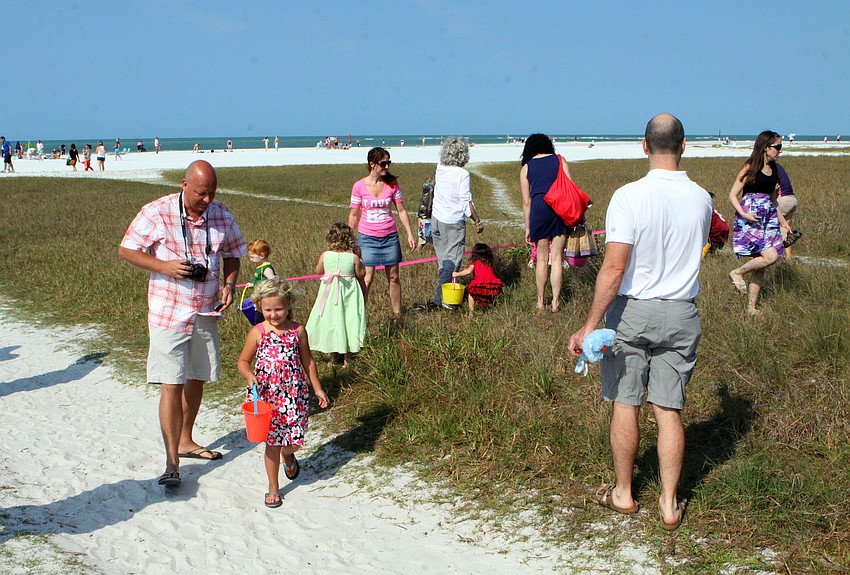 Parents and kids look around for colorful, plastic eggs, Saturday, April 7, during SKVAâ€™s Easter Egg Hunt.