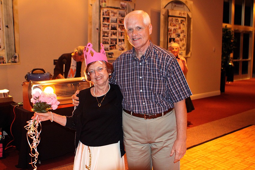The Queen of the Hop, Diane Hartm poses with Earl Mehlenbacher who picked her raffle ticket out of a basket thus making her the Queen of the Hop.
