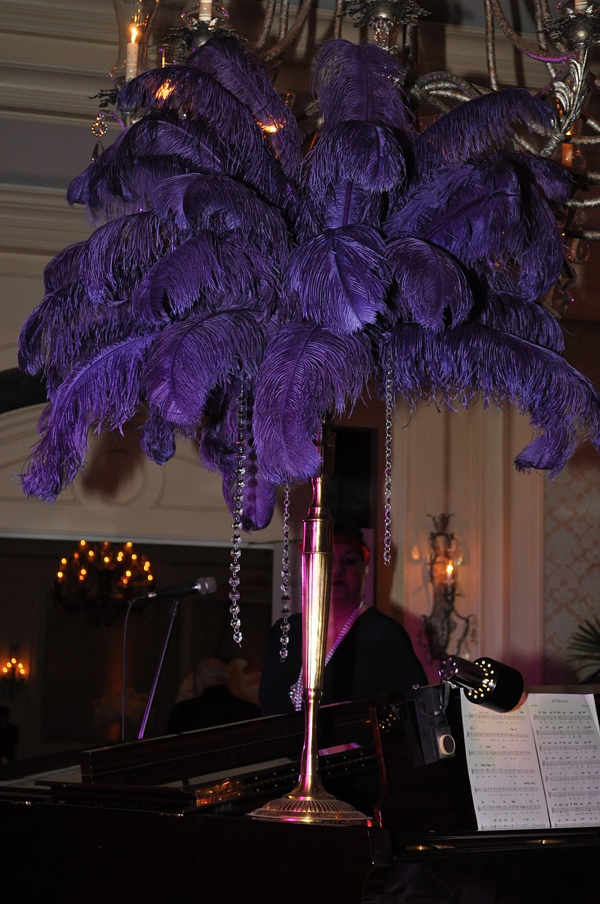 A purple feather centerpiece adorned the piano in the Cocktail and Cole Lounge.