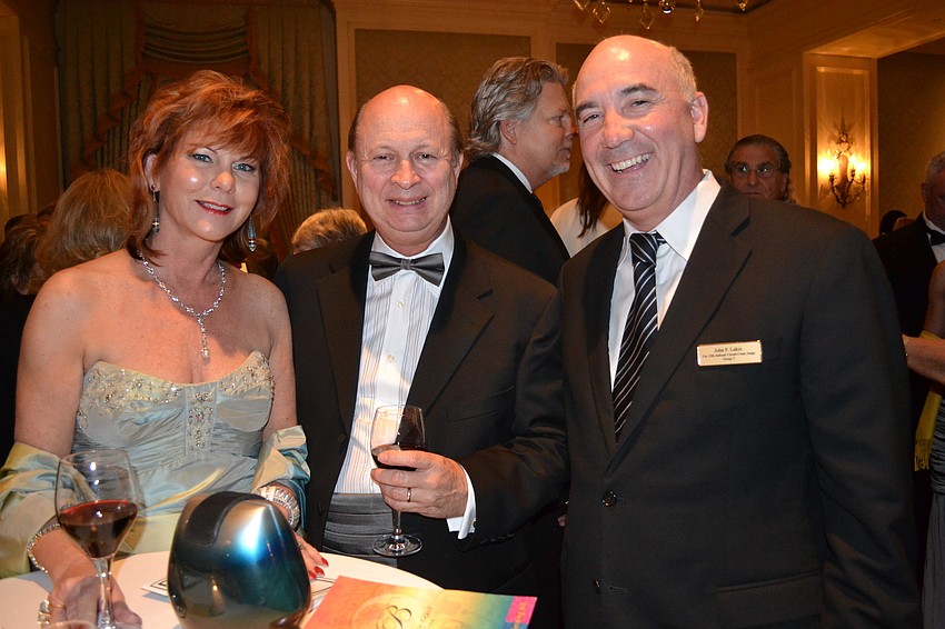 Marilee and Gary Roberts with John Lakin