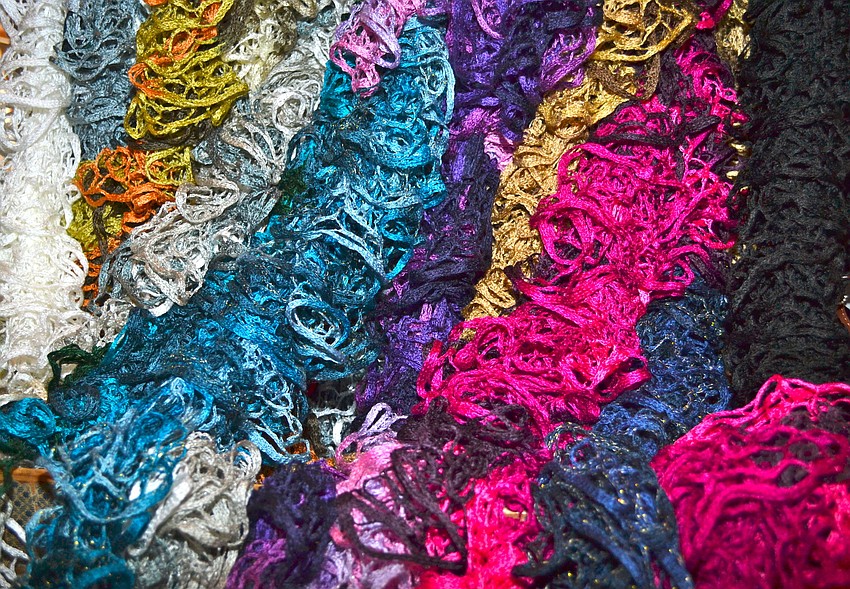 Brightly colored scarves were available for purchase.