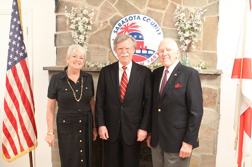 Judy Falkenthal and Chuck Volkert pose with John Bolton